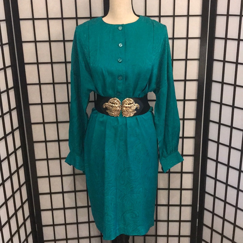 A mid length greenish turquoise dress.
